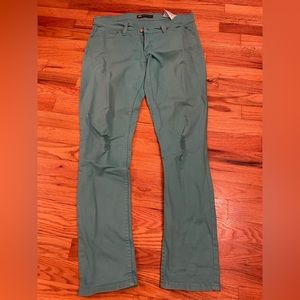 LEVI’S 524 super low distressed jeans.